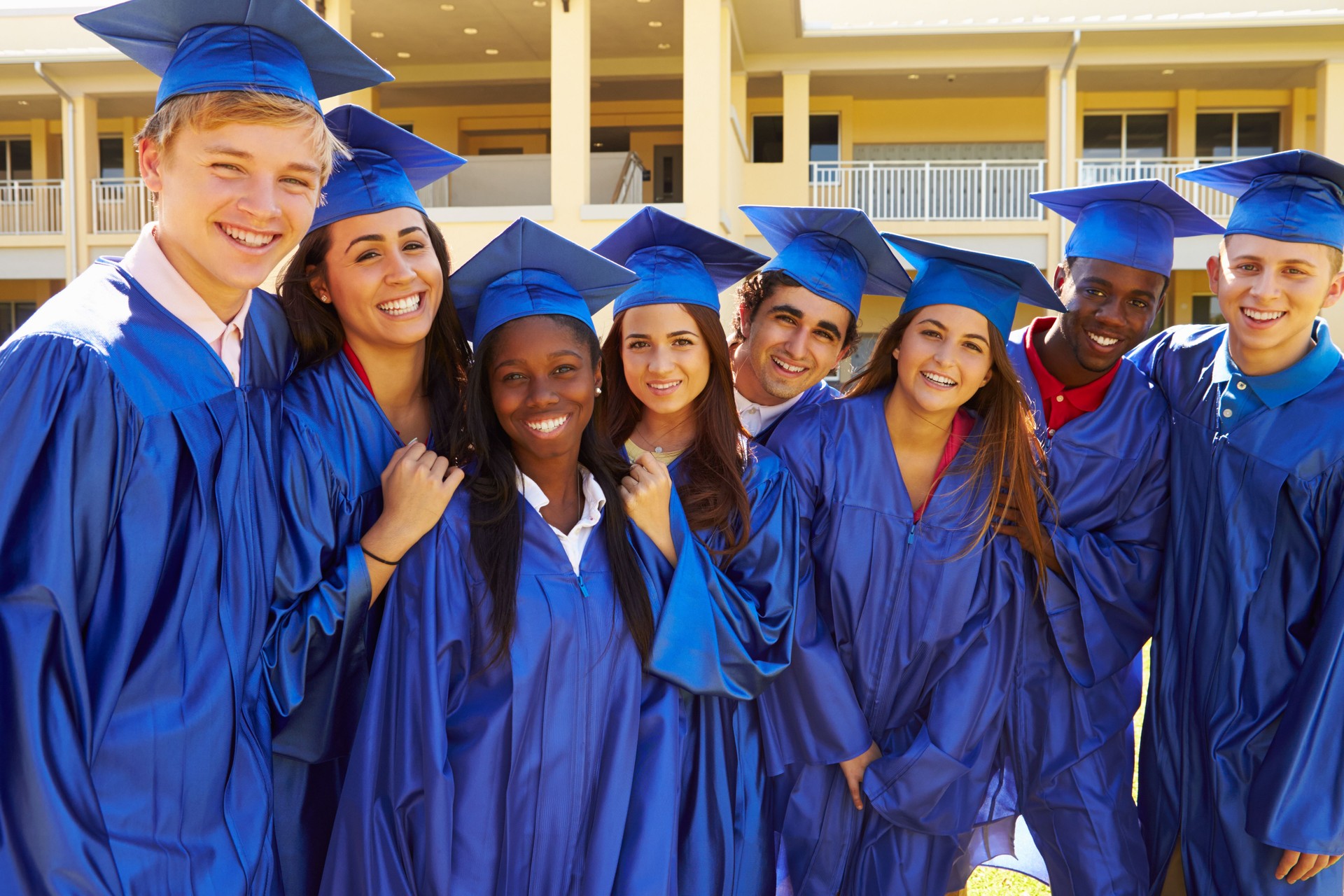 Group Of High School Students Celebrating Graduation thanks to TRIO and GEAR UP