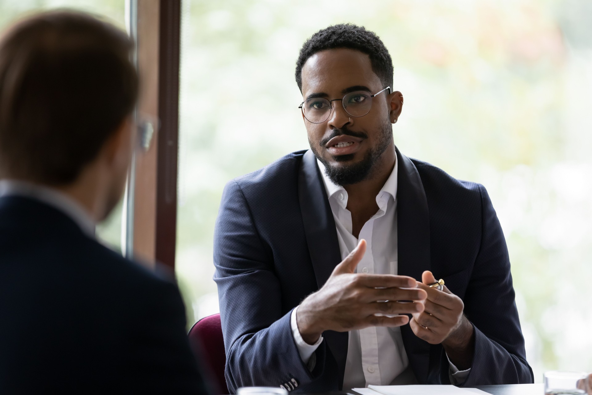 Black male coaching a New Director or leader in office