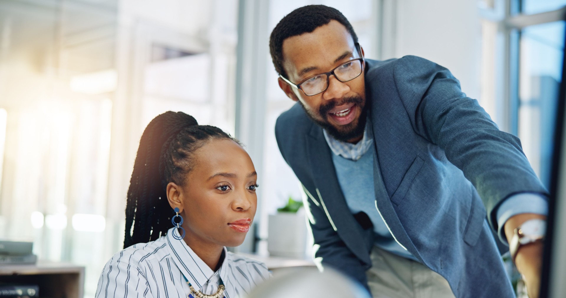 Computer, black woman and manager supporting or coaching a new director or coaching and helping with project