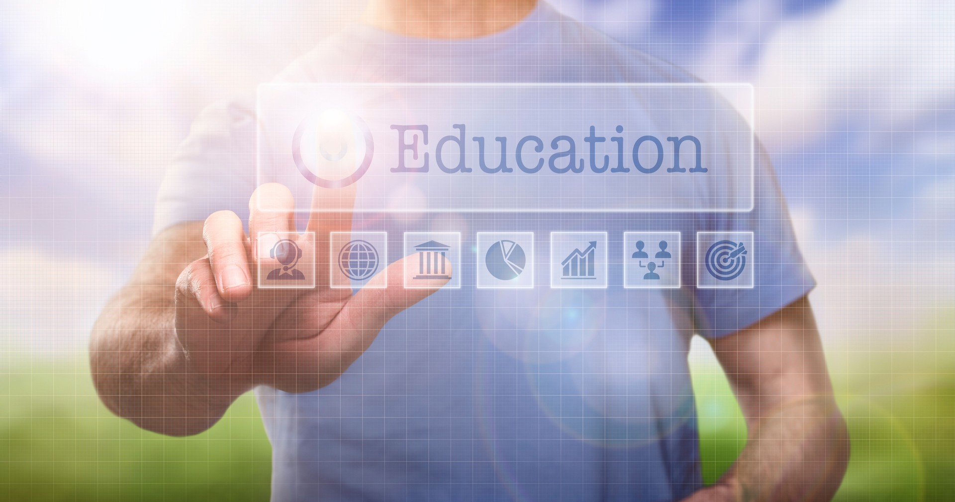 A man in a t-shirt outside selecting a Education word concept and framework